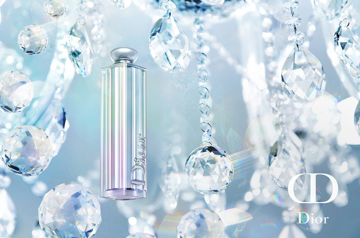 Dior lipstick among crystal drops, a product shot by our photographer